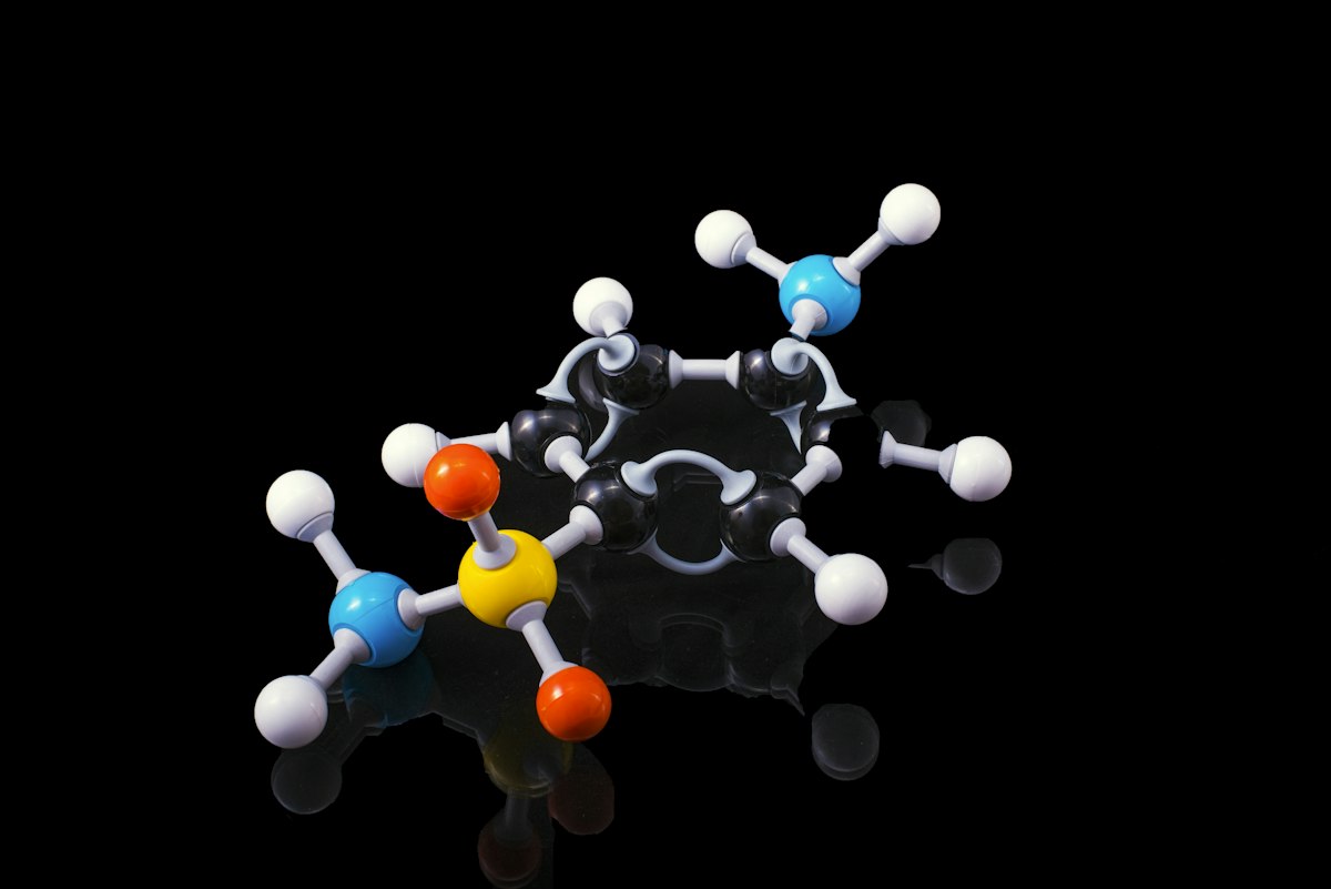 Molecular model on a black reflective surface